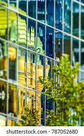 Queen Victoria Building Reflected In Modern Glass High Rise Building, Sydney City Center, Australia.
Abstract Reflections Of Green Dome Of Historic Sydney Building In Glass Facade Of Office Building.