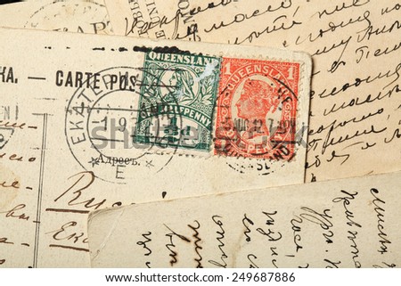 Queen Victoria postage stamps, Australia, Queensland. One penny Red stamp (1897-1911) and one half penny Green stamp. 