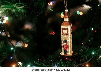 Queen's Guard Near Big Ben Christmas Ornament, Cute Toy Soldier Near Golden Watch Clock English Christmas Decoration Close-up, Surrounded By Colorful Lights 