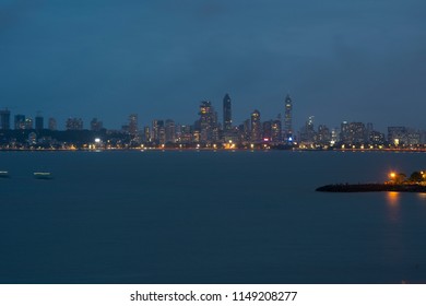 Queens Necklace At Night. Mumbai Night Skyline With Golden And Blue Tinge . Mumbai Cityscape At Night