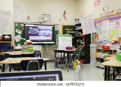 Queens, New York - March 18 2020: An Empty Classroom During The COVID-19 Closure Of NYC Public Schools. No Students In Attendance During The Shutdown. CNN Is Streaming On The Smartboard.