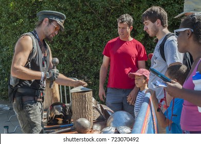 QUEENS, NEW YORK - SEPTEMBER 23, 2017: Matt Von Wilde From Toronto, Demonstrates How He Pounded Metal To Build The Body Of Heavy Meta's Fire Breathing Dragon Art Car At The World Maker Faire.