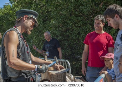 QUEENS, NEW YORK - SEPTEMBER 23, 2017: Matt Von Wilde From Toronto, Demonstrates How He Pounded Metal To Build The Body Of Heavy Meta's Fire Breathing Dragon Art Car At The World Maker Faire.