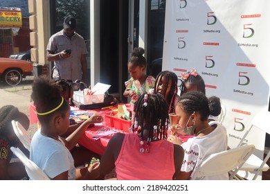 Queens, New York United States - July 10 2022: African American Girls Doing Arts And Crafts Outdoors During Family Literacy Event In Cambria Heights