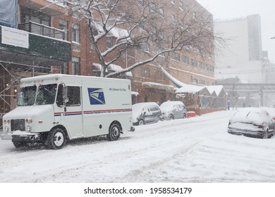 Queens, New York USA - February 1 2021: Mail Truck And Street Covered With Snow During A Massive Snowstorm In Astoria Queens New York