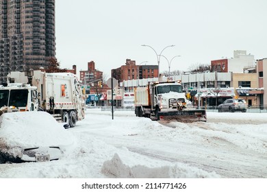 Queens, NY - Jan 29, 2022: Snow Plow Truck Clearing The Queens Boulevard During The Snow Storm