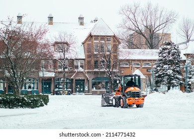 Queens, NY - Jan 29, 2022: Small Orange Snow Plow Truck Clearing The Roads In Forest Hills During Storm