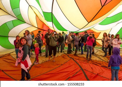 QUEENSBURY, New York - SEPTEMBER 21: Crowds Explore The Inside Of A Hot Air Baloon During Adirondack Baloon Festival On SEPTMEBR 21, 2013 In Queensbury, New York