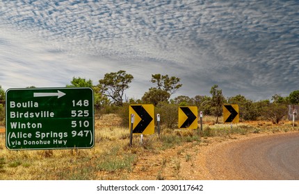 Queensland, Australia - 2005: Outback road sign on remote southwest Queensland Channel Country showing immense distances between towns.