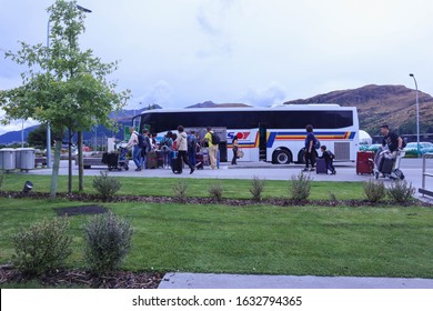 Queenstown, New Zealand 30 January 2020: Asian Tour Group Boarding A Bus At Queenstown Airport