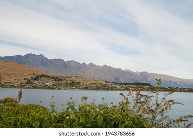 Queenstown New Zealand Scenic View Lookout With Houses On Lake Wakatipu And The Remarkables Mountains