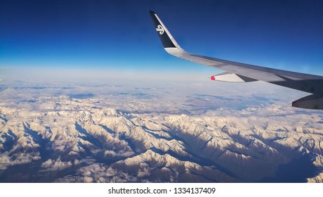 Queenstown, New Zealand-July 20, 2018: Air New Zealand flying above the southern alps mountain during morning. 