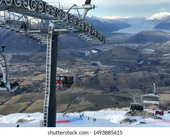 Queenstown/New Zealand: 1 May 19: Coronet Peak In Winter Season Skiing People Covered In Snow Chairlift Snowboarder Beautiful Gorgeous Landscape Of Remarkable Alps Holiday In South Island NZ 