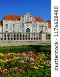 Queluz, Sintra, Portugal - oktober 30, 2016: hanging gardens with multicolor flowers and baroque facades of the Queluz Royal Palace. Formerly used as summer residence by the Portuguese royal family.