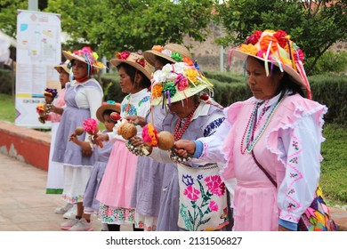 Queretaro, Queretaro, Mexico- November 11th,2018: Traditional Mexican dance by an ethnic group. Women wear colorful hats with ribbons and flowers. 