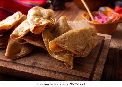 Quesadillas Doradas. Fried Quesadillas Made With Corn Tortillas, They Can Be Filled With Any Dish Or Ingredient, Such As Meat, Potato Or Fish Such As Marlin Or Tuna, Popular During The Lenten Season.