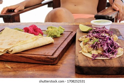 Quesadillas And Tacos On A Wooden Board In The Beach Of Tulum, Mexico. Appetizing Mexican Food. Traditional Mexican Cuisine.