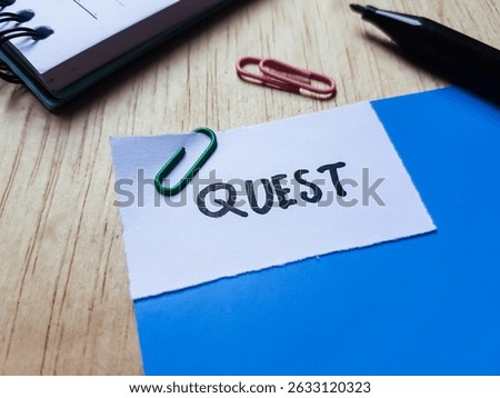 Quest writting on table background.
