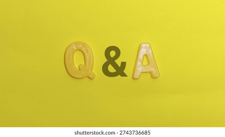 Question and answer abbreviation formed by letters centered on vibrant yellow background represents concept of asking and receiving knowledge.