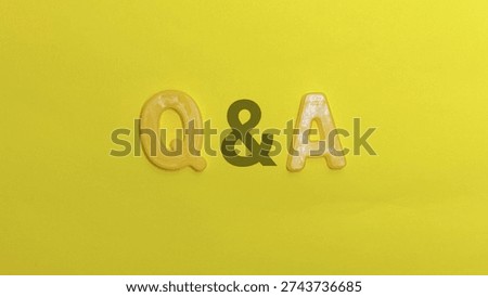 Question and answer abbreviation formed by letters centered on vibrant yellow background represents concept of asking and receiving knowledge.