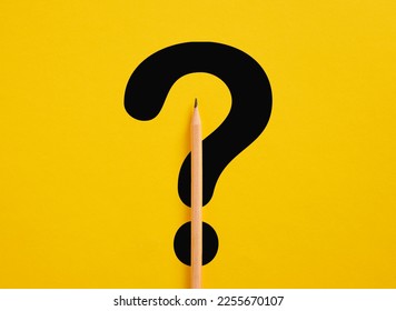 Question and answer. Problem solving. Business solutions. FAQ frequently asked questions. Question mark symbol under a pencil on yellow background.