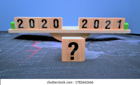 Question Mark With 2020 And 2021 Wood Blocks On Scale. Global Business Economics Future Prediction After Covid-19 Financial Crisis. Forecast Future Happens After Recovering From Coronavirus Impact.