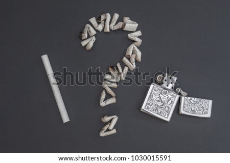 Question mark of cigarette butts, cigarette and gasoline lighter. To give up smoking. Stop smoking message