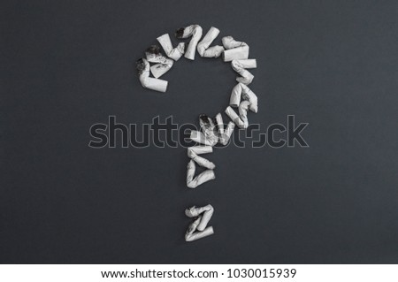 Question mark of cigarette butts. To give up smoking. Stop smoking message