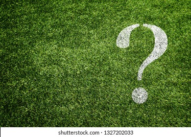 Question mark drawn on the turf - Shutterstock ID 1327202033