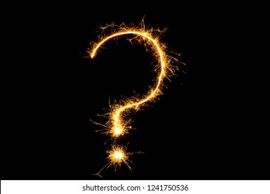 Question Mark Of Fireworks Close Up. Burning Sparkler Question Mark Isolated On Black Background. Sign Of Sparklers To Overlay On Texture For Design