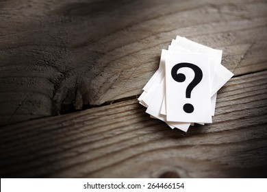 Question mark heap on table concept for confusion, question or solution - Shutterstock ID 264466154