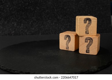 Question Mark On 3 Wood Blocks, Isolated On Dark Background