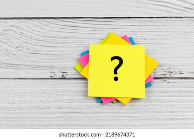 Question mark on adhesive paper note