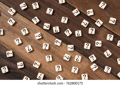 Question mark on alphabet tiles. question mark on wooden table background