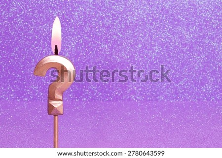 Question mark on a pink background with blurred bright dots - Birthday or anniversary card with abstract blurred dots that glow