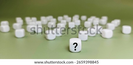 Question Mark on Single Dice with Many White Dice in Background Representing Uncertainty, Risk, Strategic Choice, and Probability in Decision Making. 
