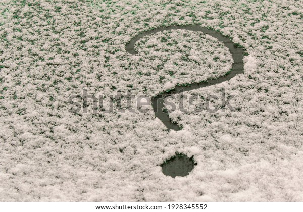 A question mark on the\
snow-covered car window. The concept of finding answers to\
questions