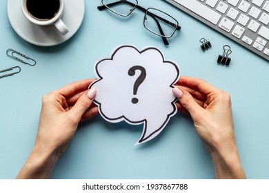 Question mark on speech bubble in hands. FAQ or search information