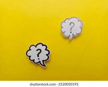 Question mark on speech bubble paper cut note isolated on yellow background. Frequently asked questions concept.  - Powered by Shutterstock - Get 15% off with code: PIKWIZARD15