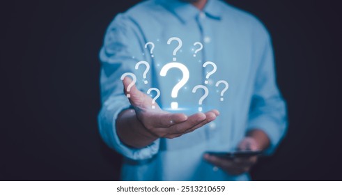 Question mark and problem analysis Concept, businessman hand with question mark show how to think analytically creatively or find out reasons that occur during work process of business.