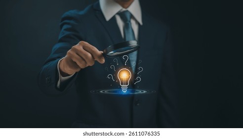 Question mark and problem concept, businessman hold magnifying glass with light bulb and question mark icon show how to do root cause analysis to find answer that occurs during business process.