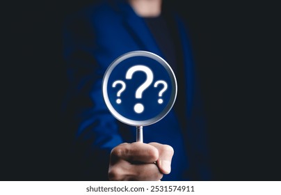 Question mark, Problem solving and analysis concept. Businessman holds magnifying glass focused on question mark, analysis, problem solving, identifying cause of issues during work process, solution,