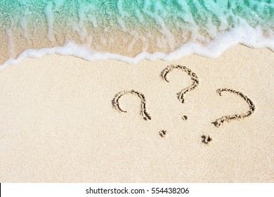 question mark sign handwritten in sand beach - Powered by Shutterstock