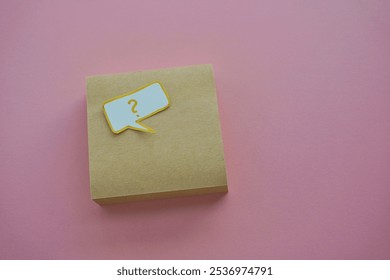 question mark in speech bubble on pink background. A piece of paper with a question mark, pinned to a pink surface, evoking curiosity. blank sticky notes. - Powered by Shutterstock - Get 15% off with code: PIKWIZARD15