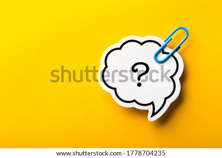 Question Mark Speech Bubble paper is isolated on the yellow background.