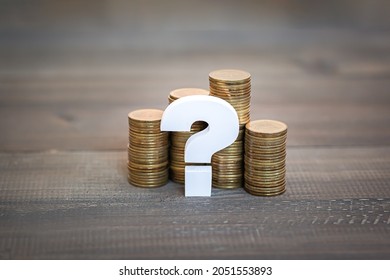 Question mark with stack of money coin , Problem Concept
