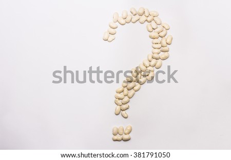 question mark with white beans on a white background