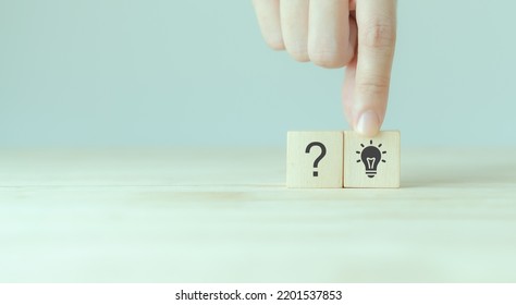 Question marks and light bulb symbolizing idea or solution. Problem solving skill, creativity, innovation, brainstorming, critical thinking and root cause analysis concept. Question, idea and answer. - Shutterstock ID 2201537853