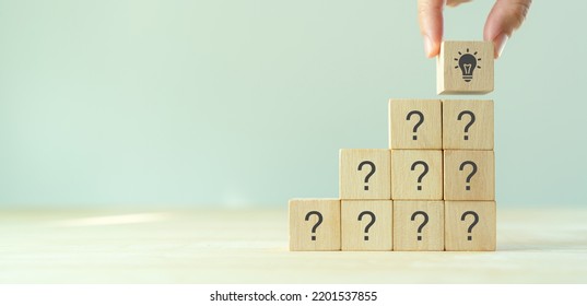 Question marks and light bulb symbolizing idea or solution. Problem solving skill, creativity, innovation, brainstorming, critical thinking and root cause analysis concept. Question, idea and answer. - Shutterstock ID 2201537855