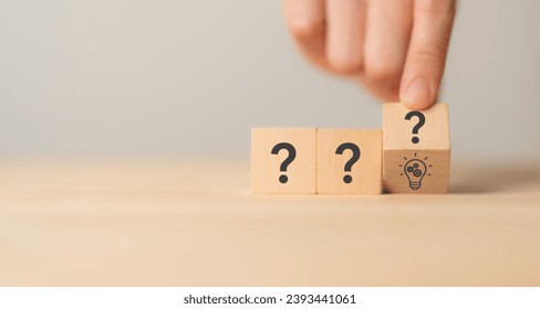 Question marks and light bulb symbolizing idea or solution. Problem solving skill, creativity, innovation, brainstorming, critical thinking and root cause analysis concept. Question, idea and answer.